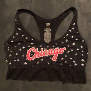 PINK sports bra, size medium, black with silver stars with HOT pink writing